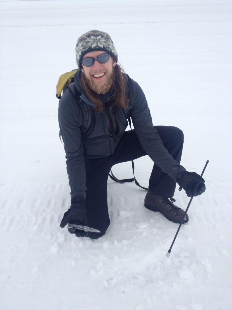 On the walk back, Richard spotted an antenna coming out of the snow road. Turns out, it was an antenna that had come off one of the many vehicles that drove along the road. He dug it out with his knife.