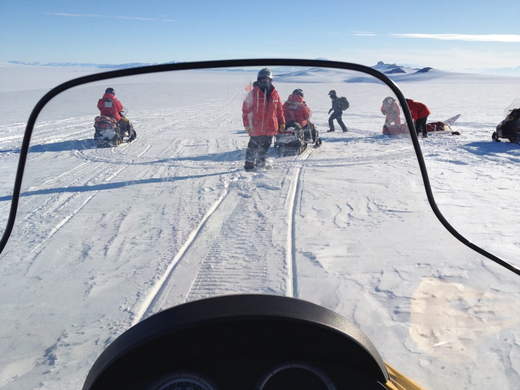 The view through my windshield on the way back from Room with a View. We had to stop because the leader's sled fell off his snowmobile. He was going quickly, I think. 