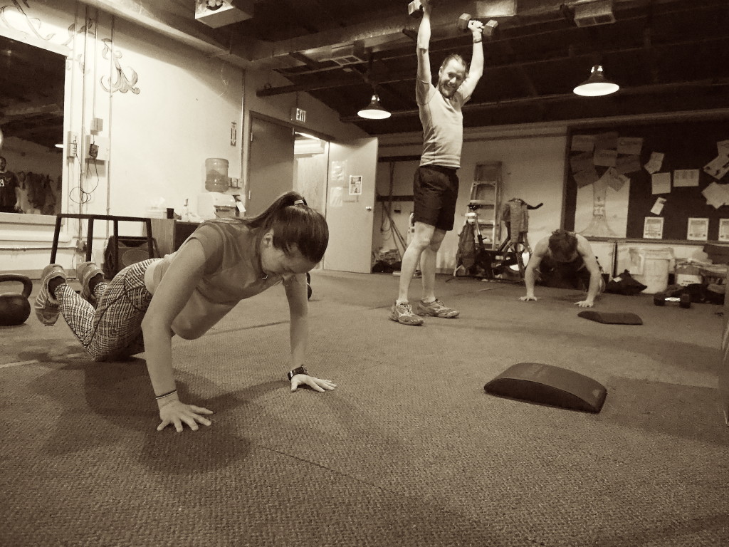 This is us at CrossFit. Richard is laughing at my form, or at the expression on my face giving away the pain I'm feeling in my umpteenth burpee. (I hate burpees.)