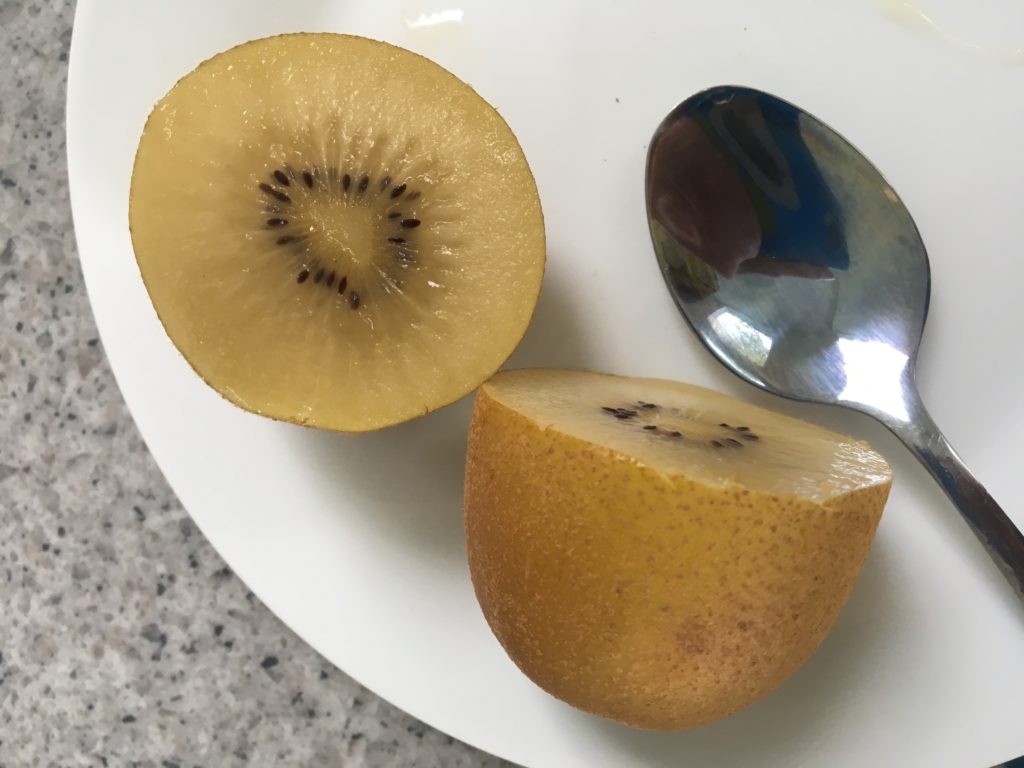 The clear yellow fruit of the delicious golden kiwi.